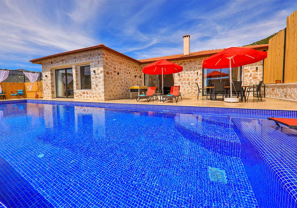 A luxury stone villa with a pool in Kalkan